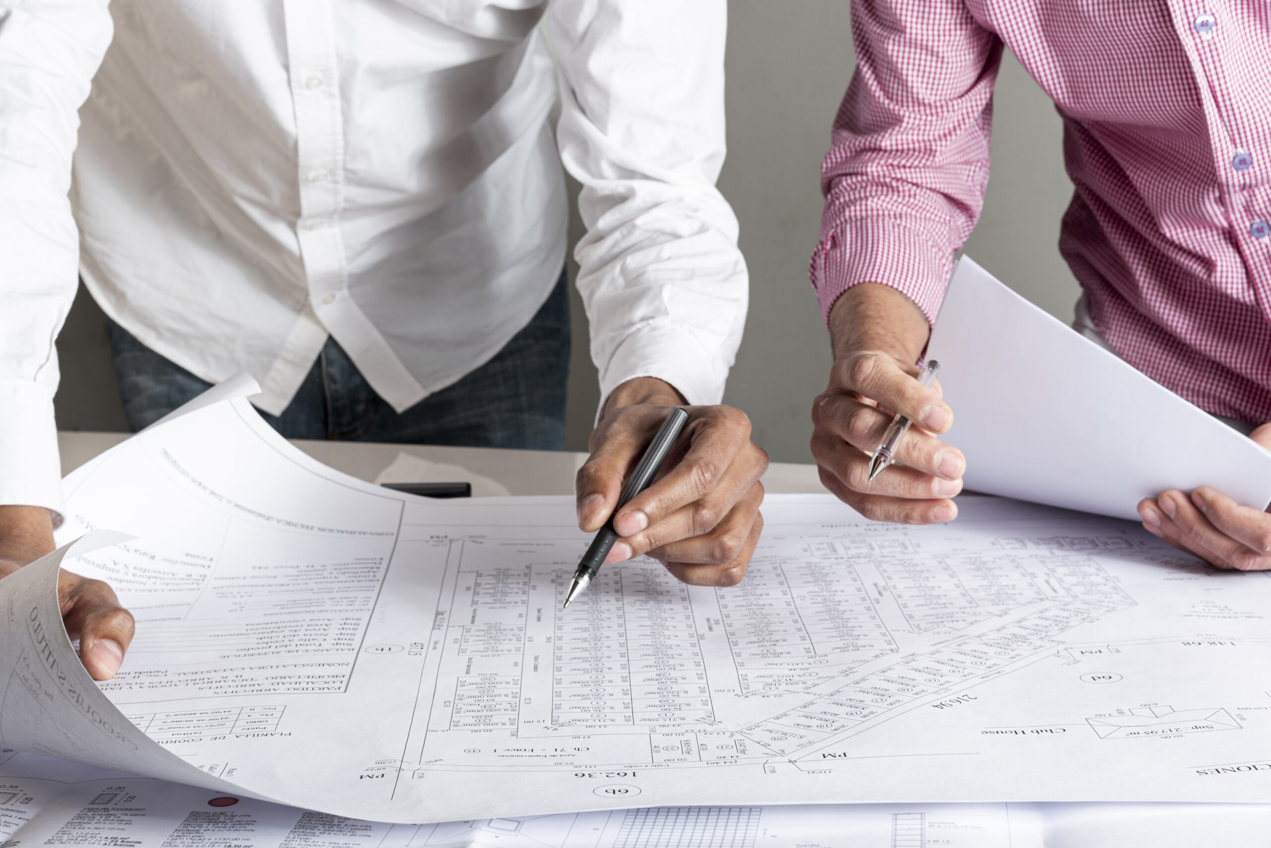 People working on a blueprint