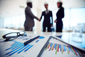 Executives discussing blueprints
