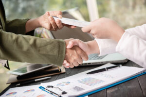 People shaking hands finishing up a meeting